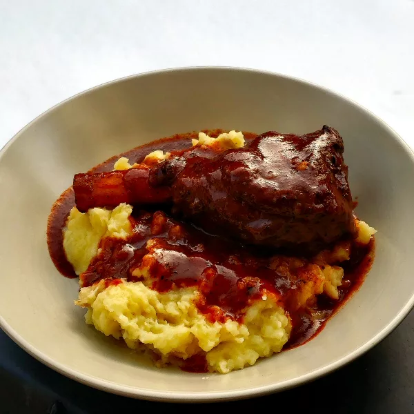 Grilled lamb shank plated