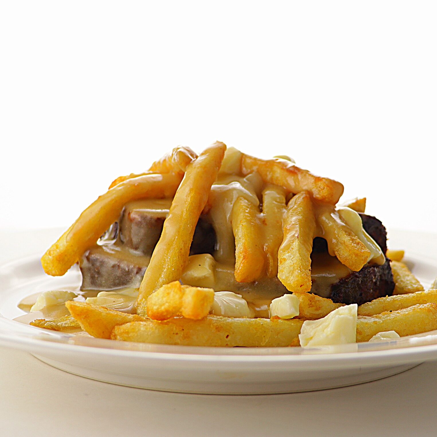 smoked meatloaf poutine plated with fries