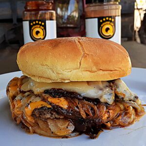 oklahoma onion burger plated with jars