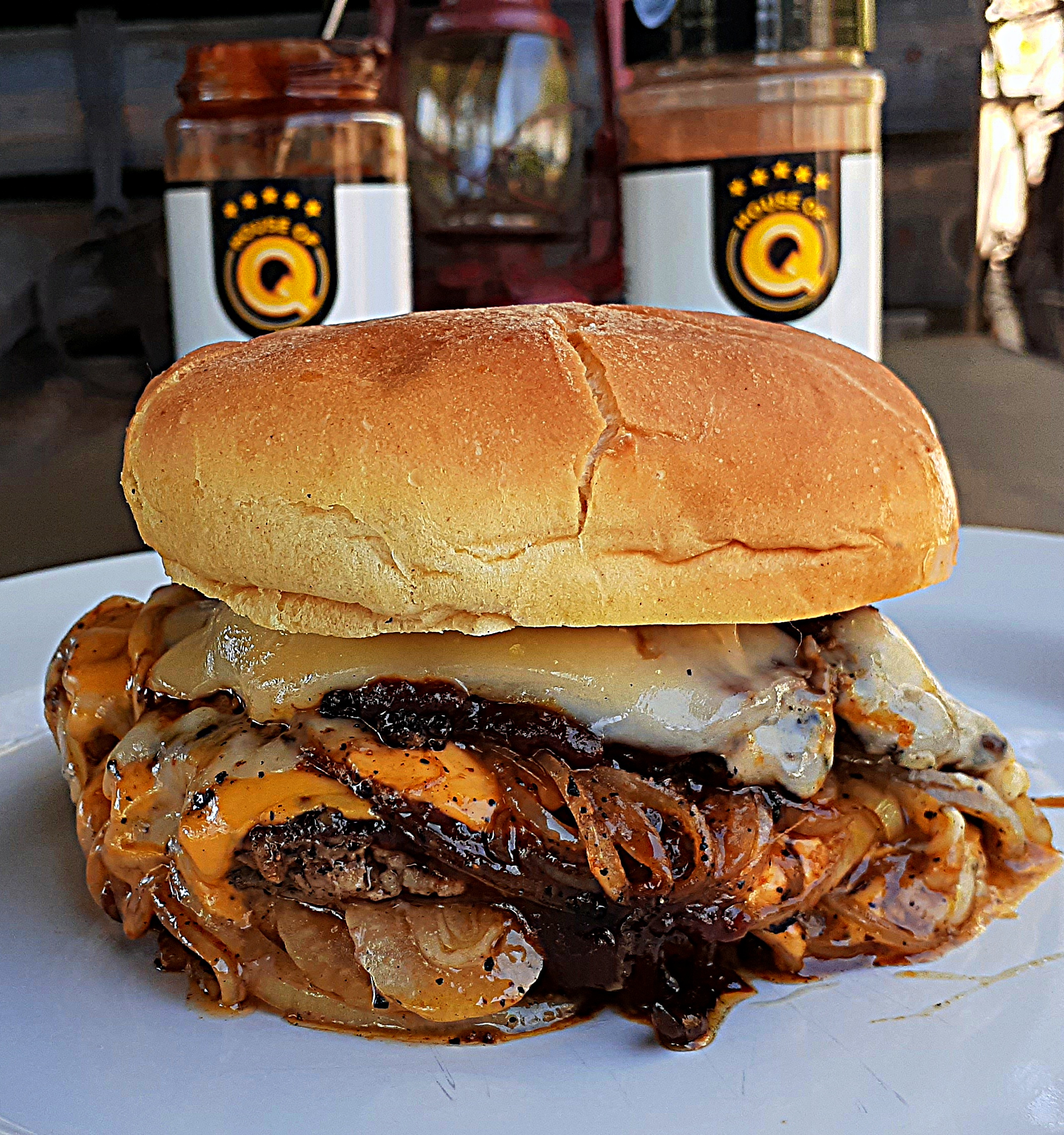 oklahoma onion burger plated with jars