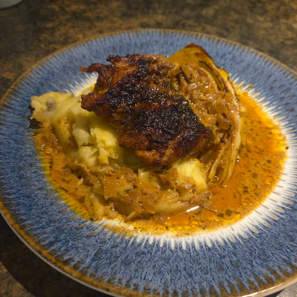 plated chicken and cabbage in mustard cream sauce