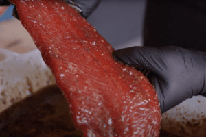 salmon being removed from cure