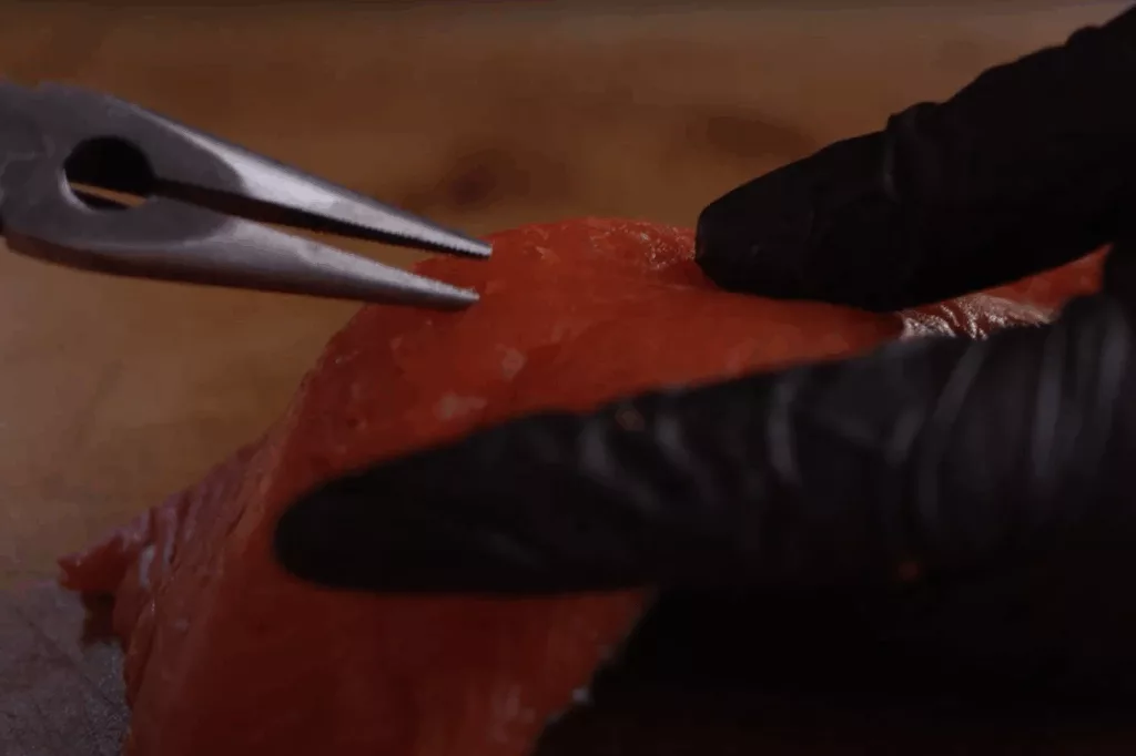salmon with pliers