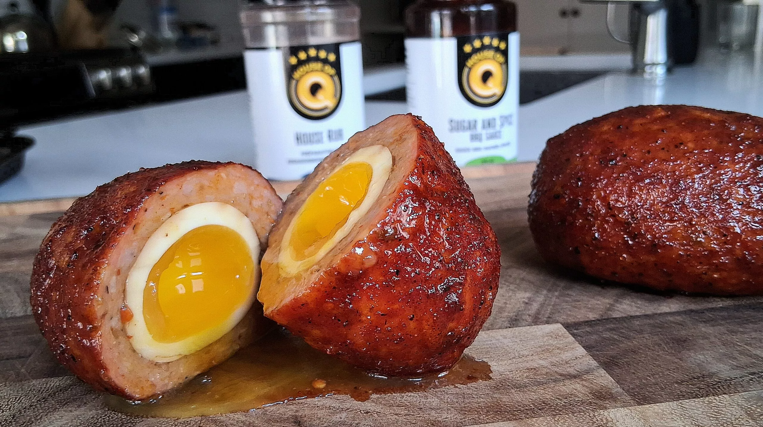 split scotch eggs with creamy egg yolk square